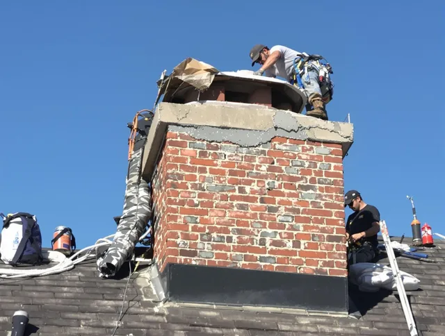 Irvine Chimney Sweep installing a custom chimney crown in Irvine, CA