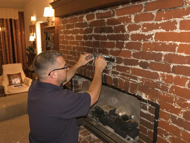 Irvine Chimney Sweep expert fixing a fireplace in Irvine, CA